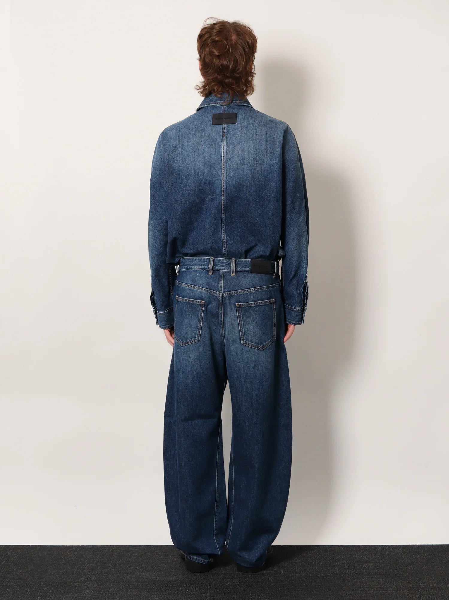 Twisted stone-washed denim jeans