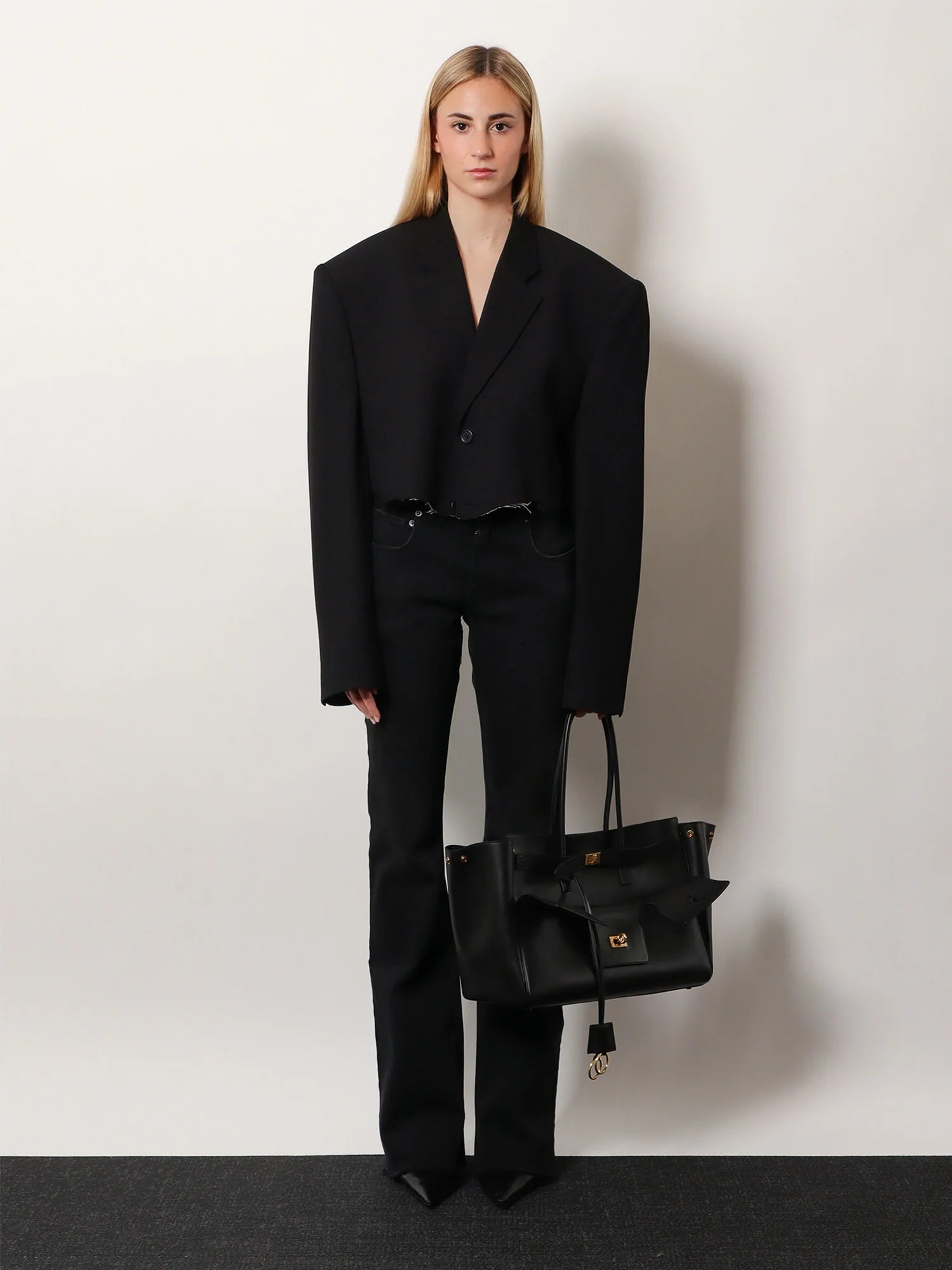 Denim trousers with frayed edges