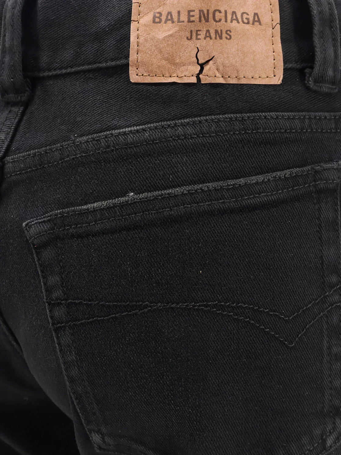 Denim trousers with frayed edges
