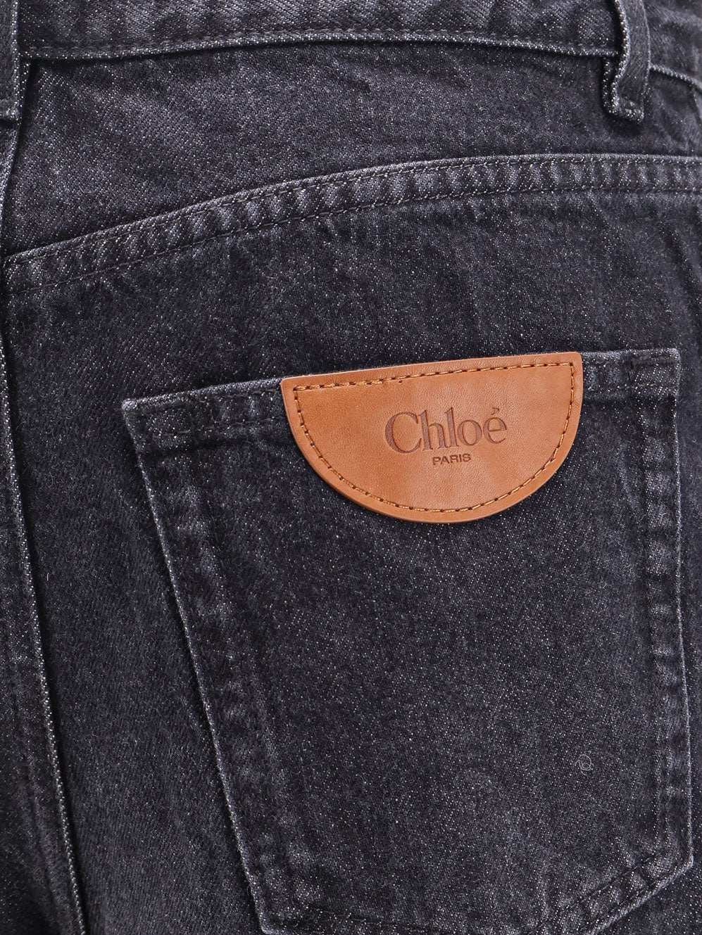 Jeans with iconic leather logo tag