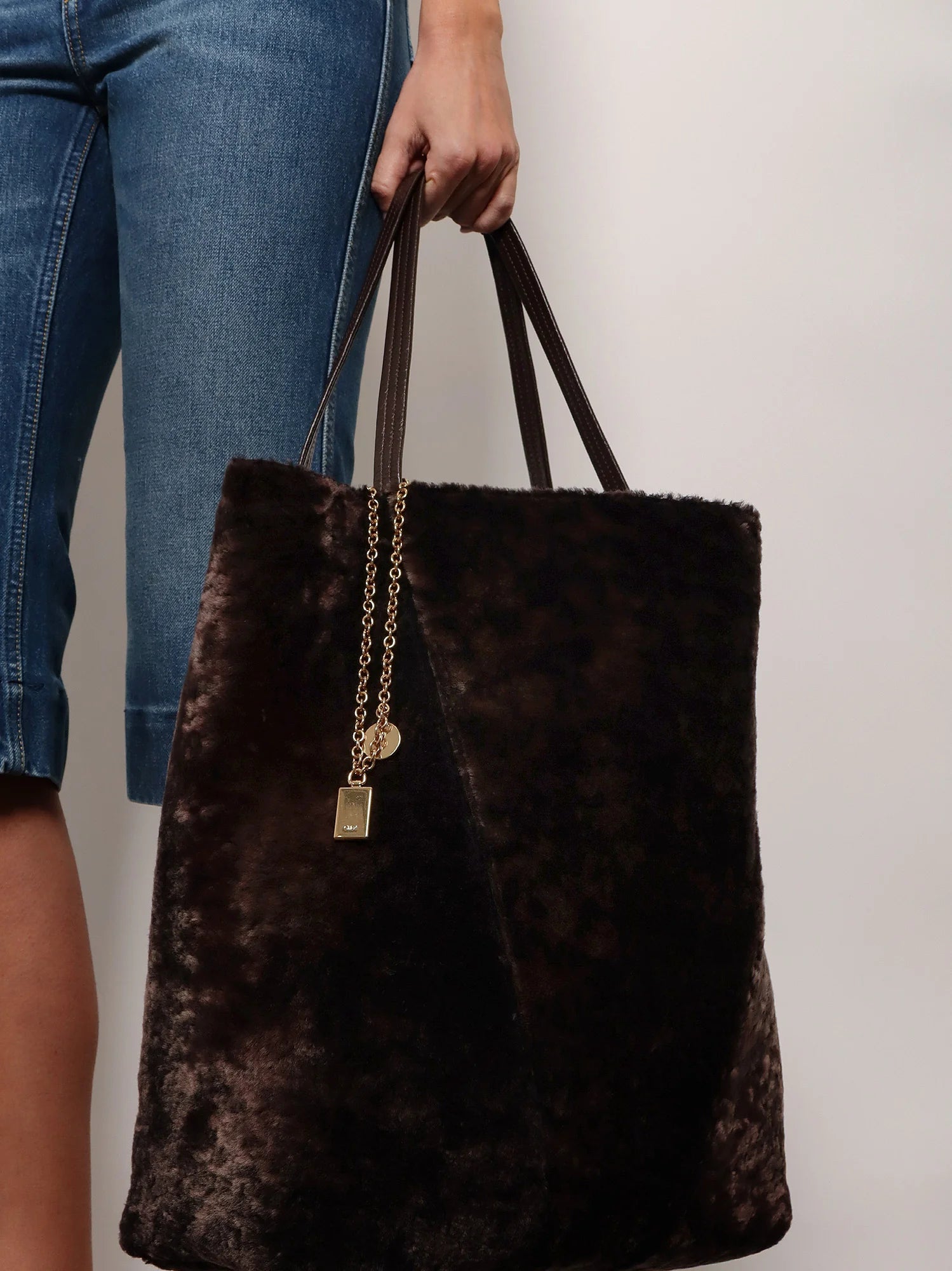 Spin shearling shoulder bag