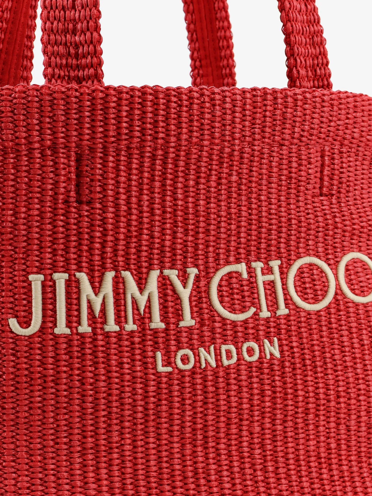 Raffia shopping bag with lettering logo on the front