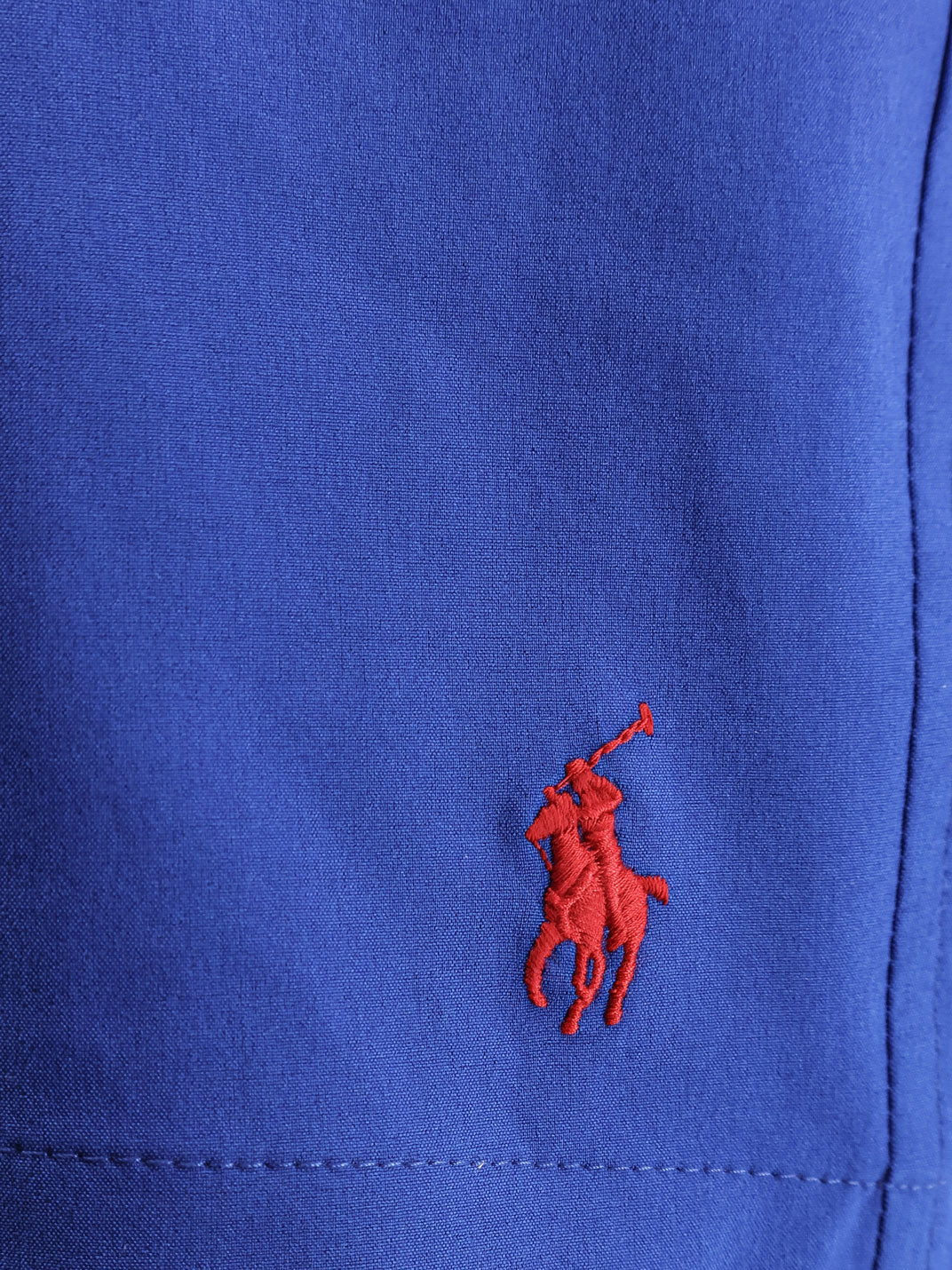 Recycled nylon swim trunks with embroidered logo on the front