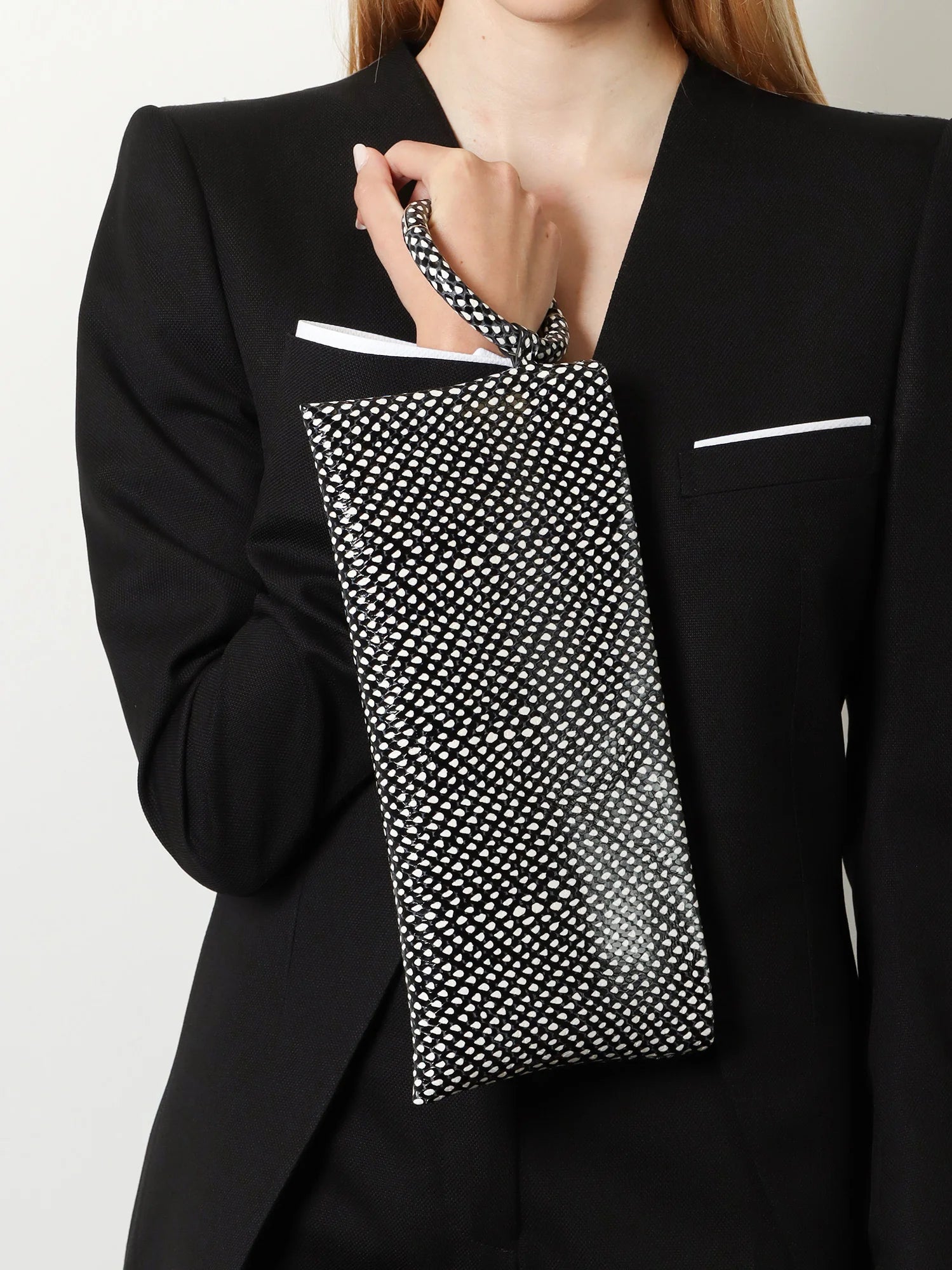 Aura leather clutch bag with lettering logo on the front