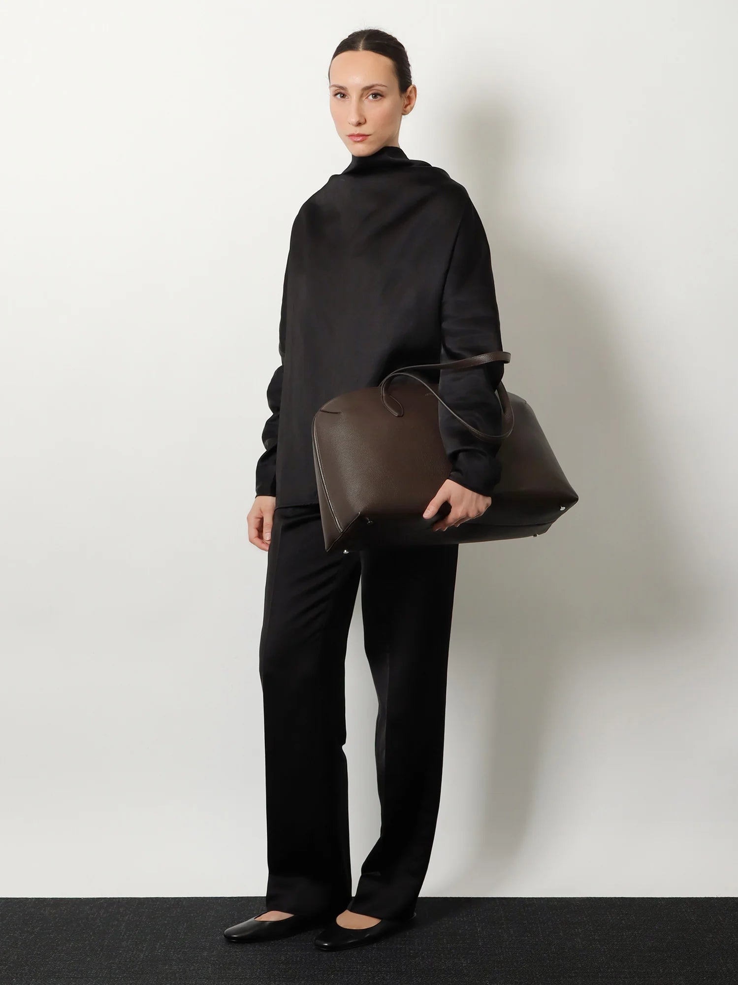 Suede handbag with engraved logo on the front