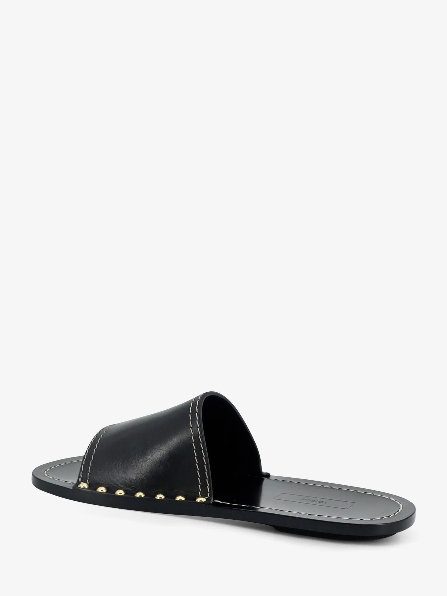 Low leather sandals with metal studs on the sides