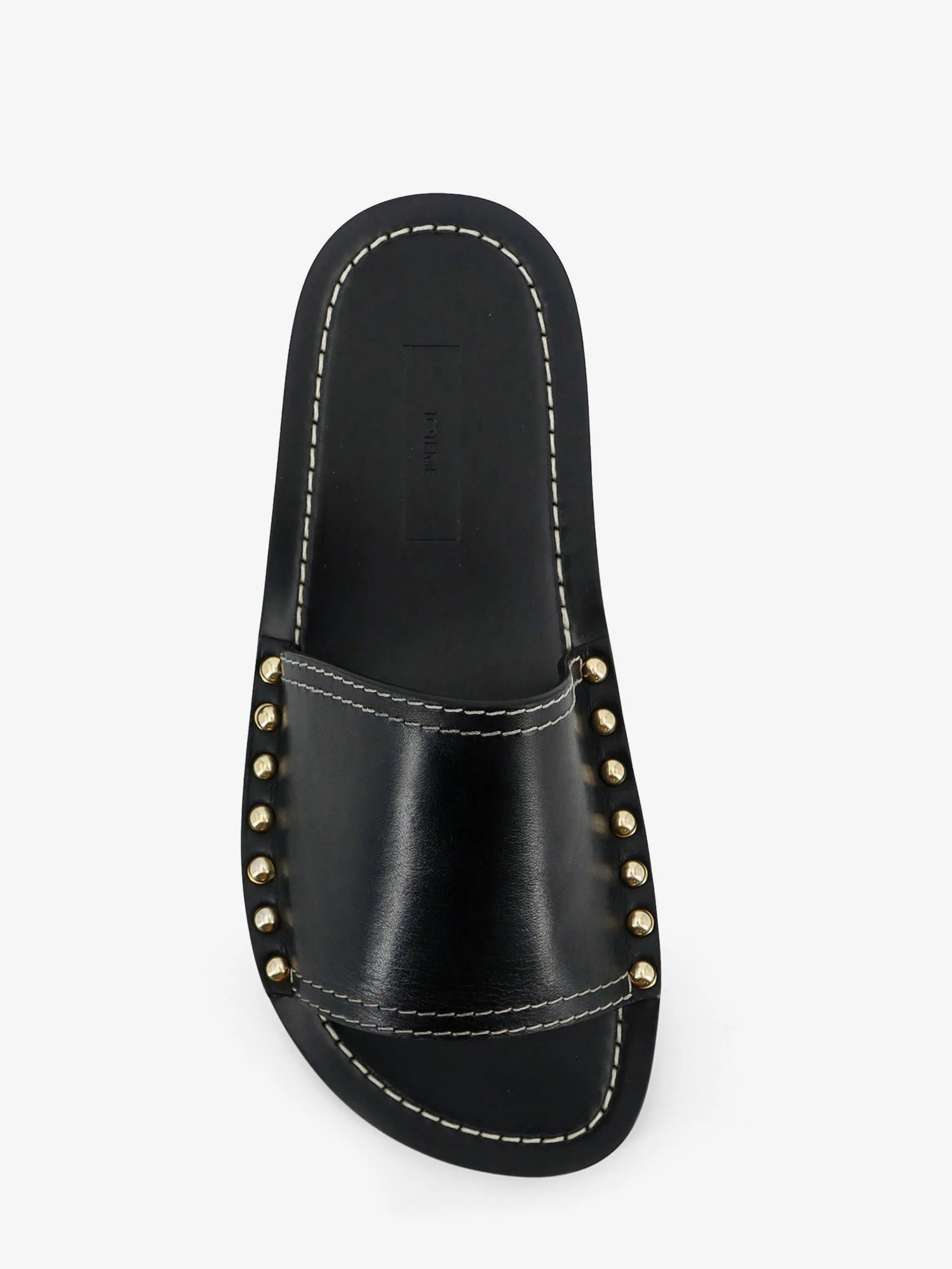 Low leather sandals with metal studs on the sides