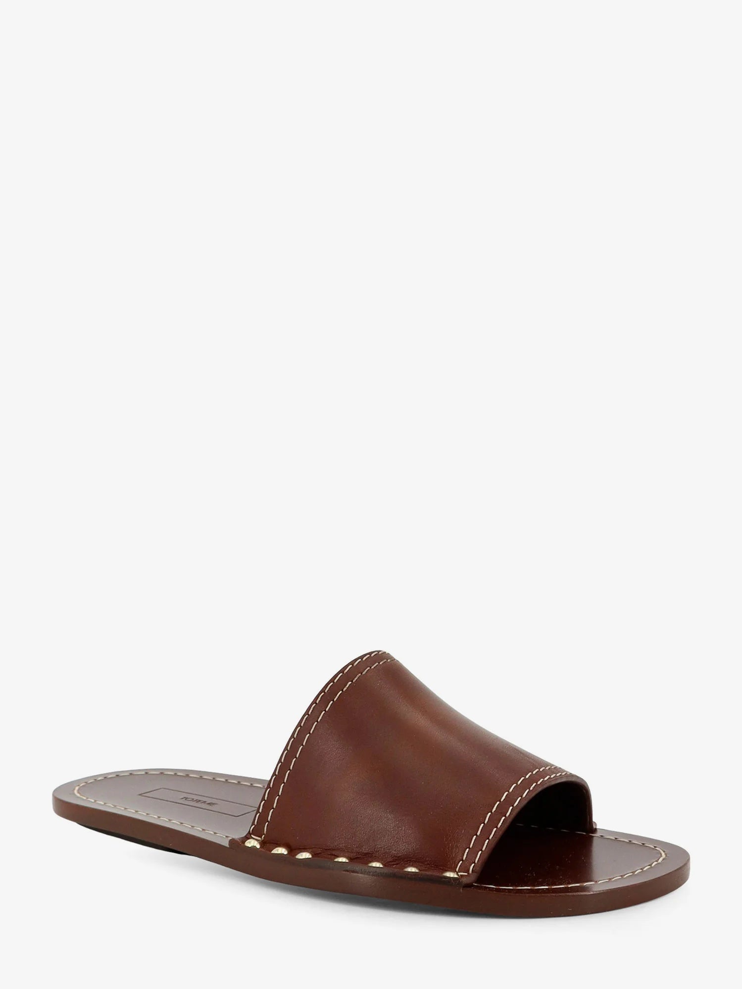 Low leather sandals with metal studs on the sides