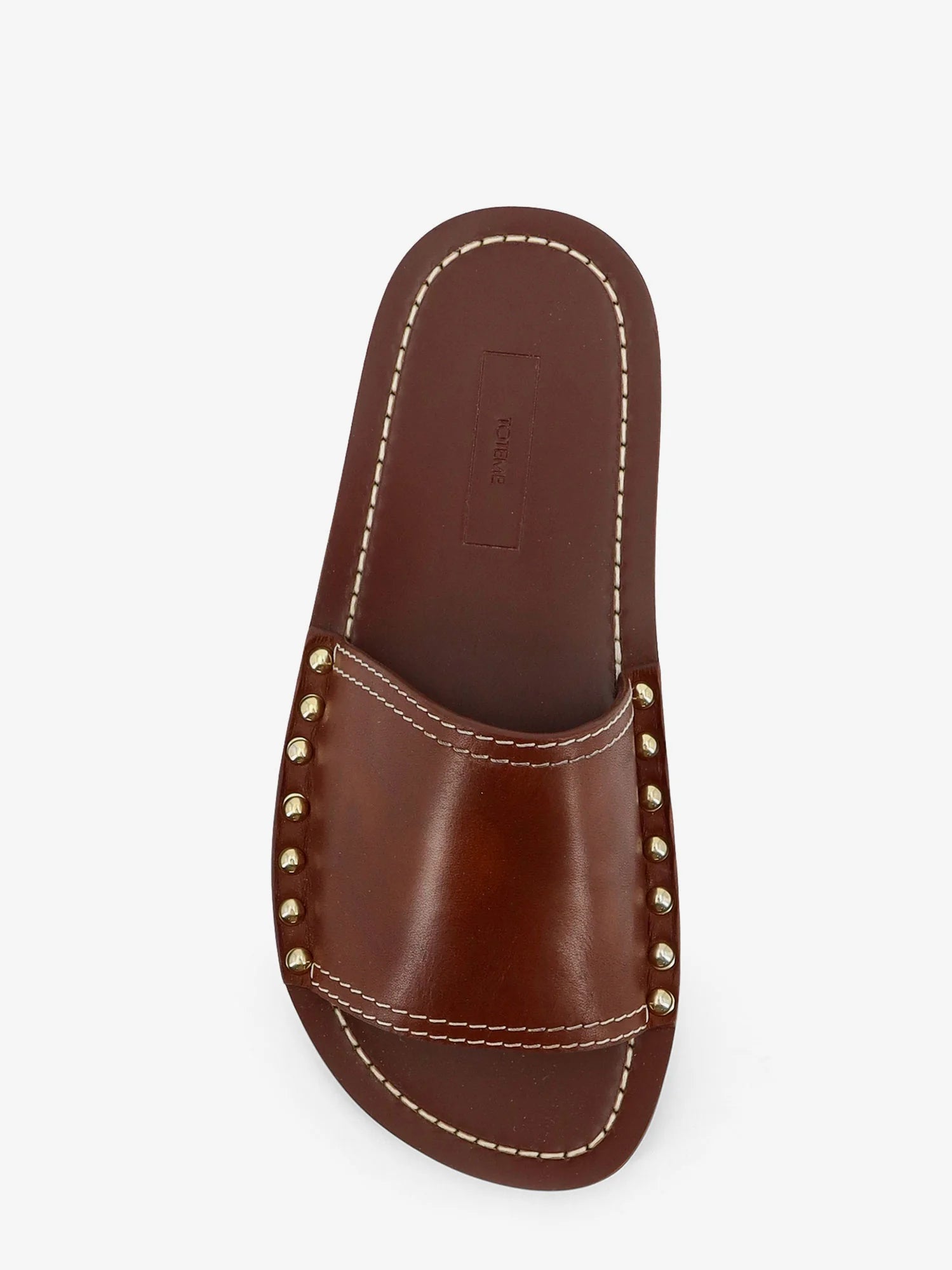 Low leather sandals with metal studs on the sides