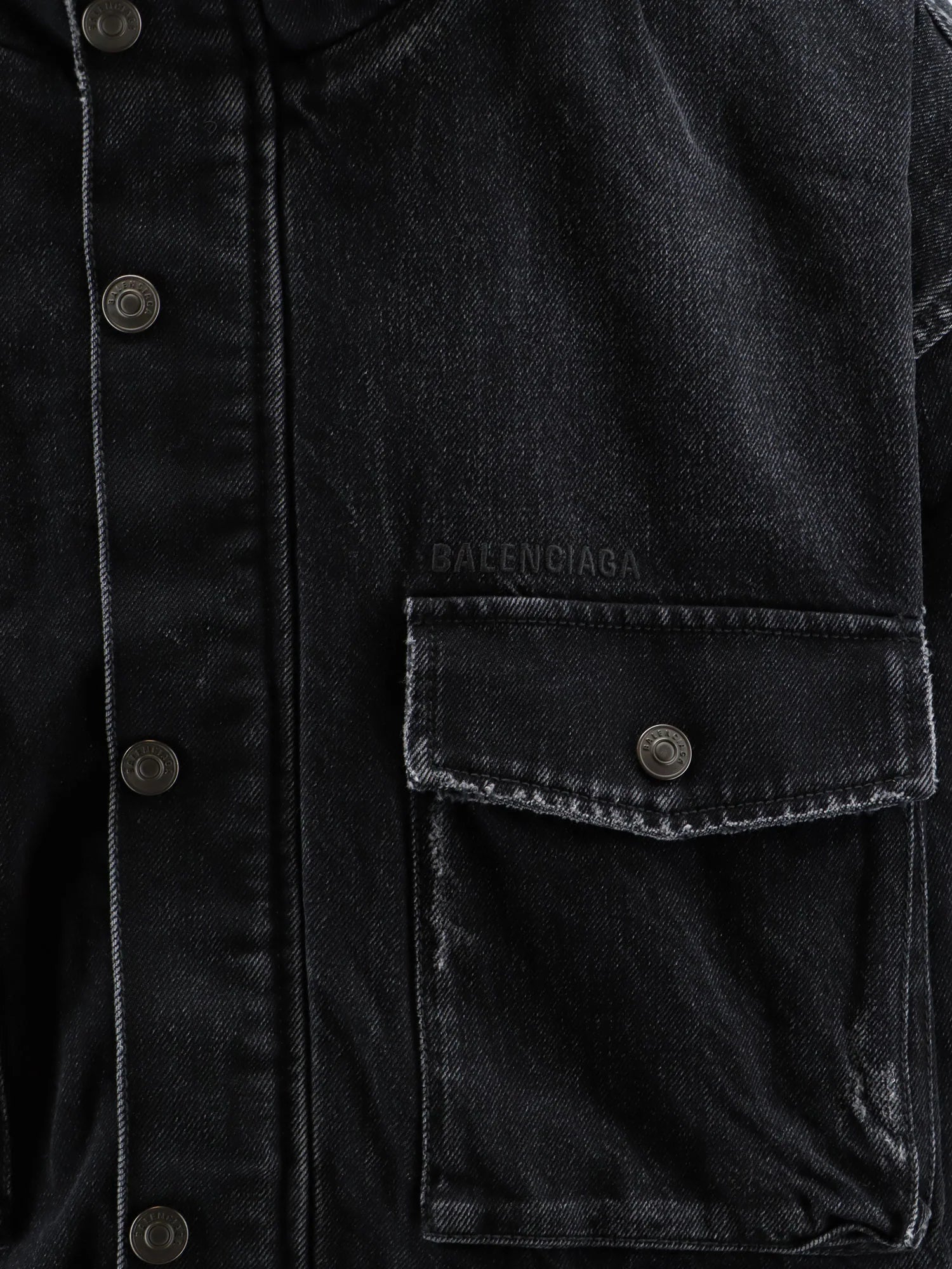 Black denim jacket with embroidered logo on the front