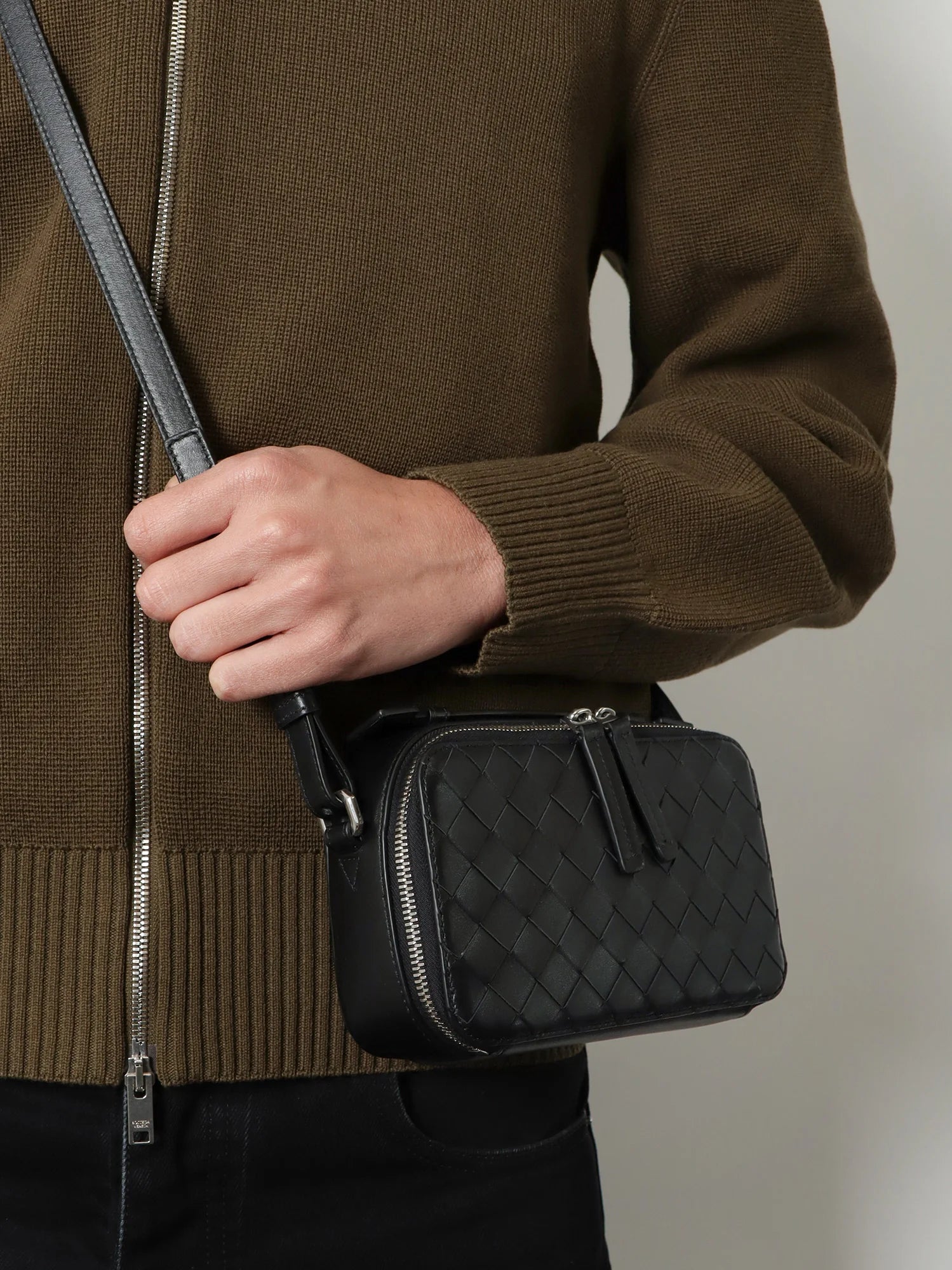 Leather clutch bag with Intrecciato motif