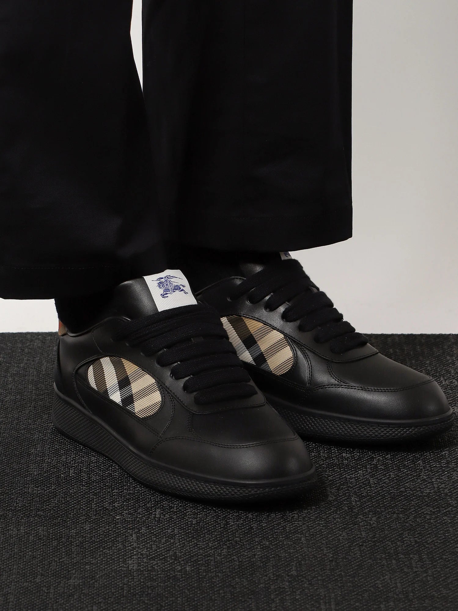 Leather sneakers with Traditional Check inserts