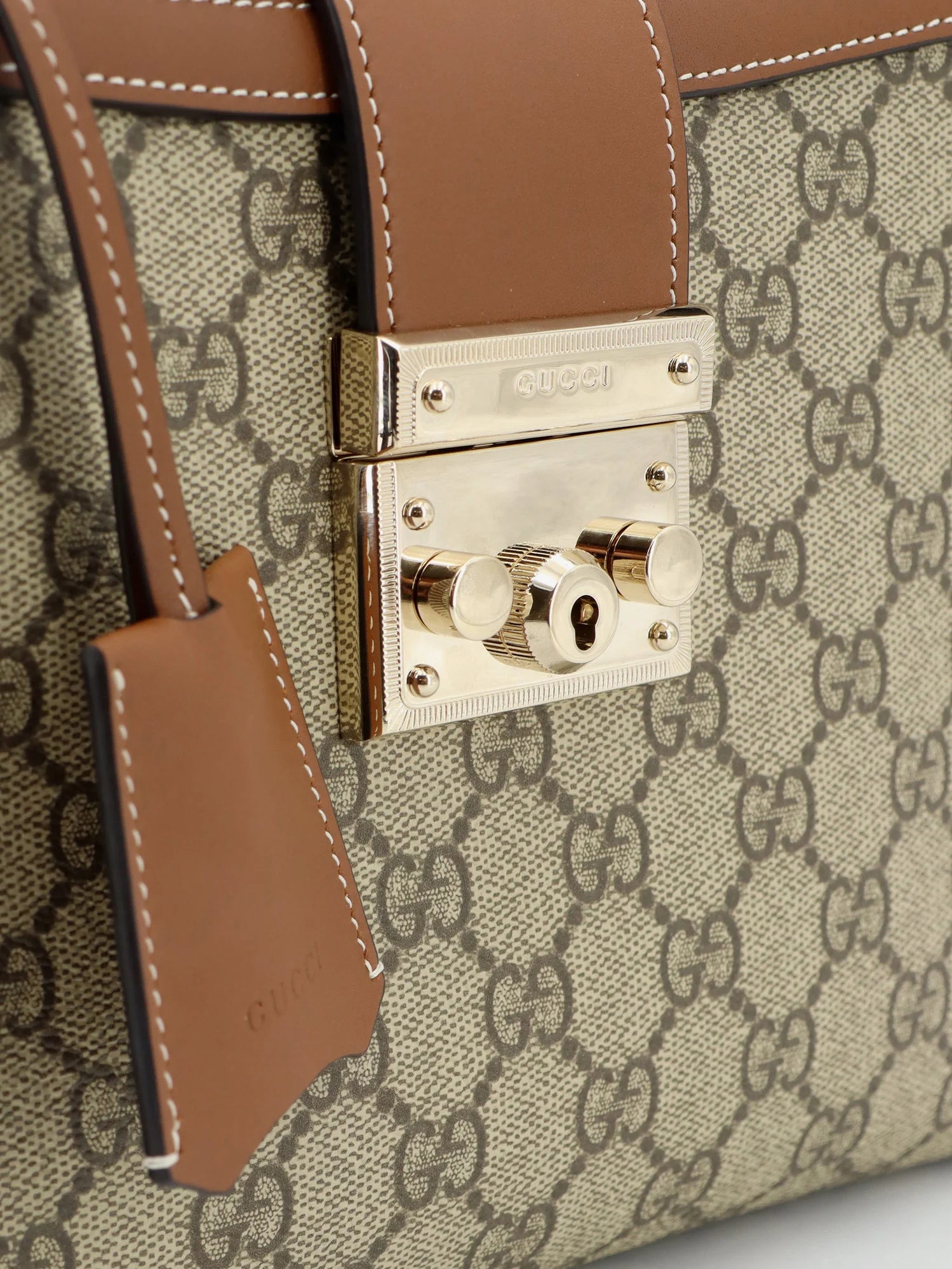 Padlock handbag with shoulder strap