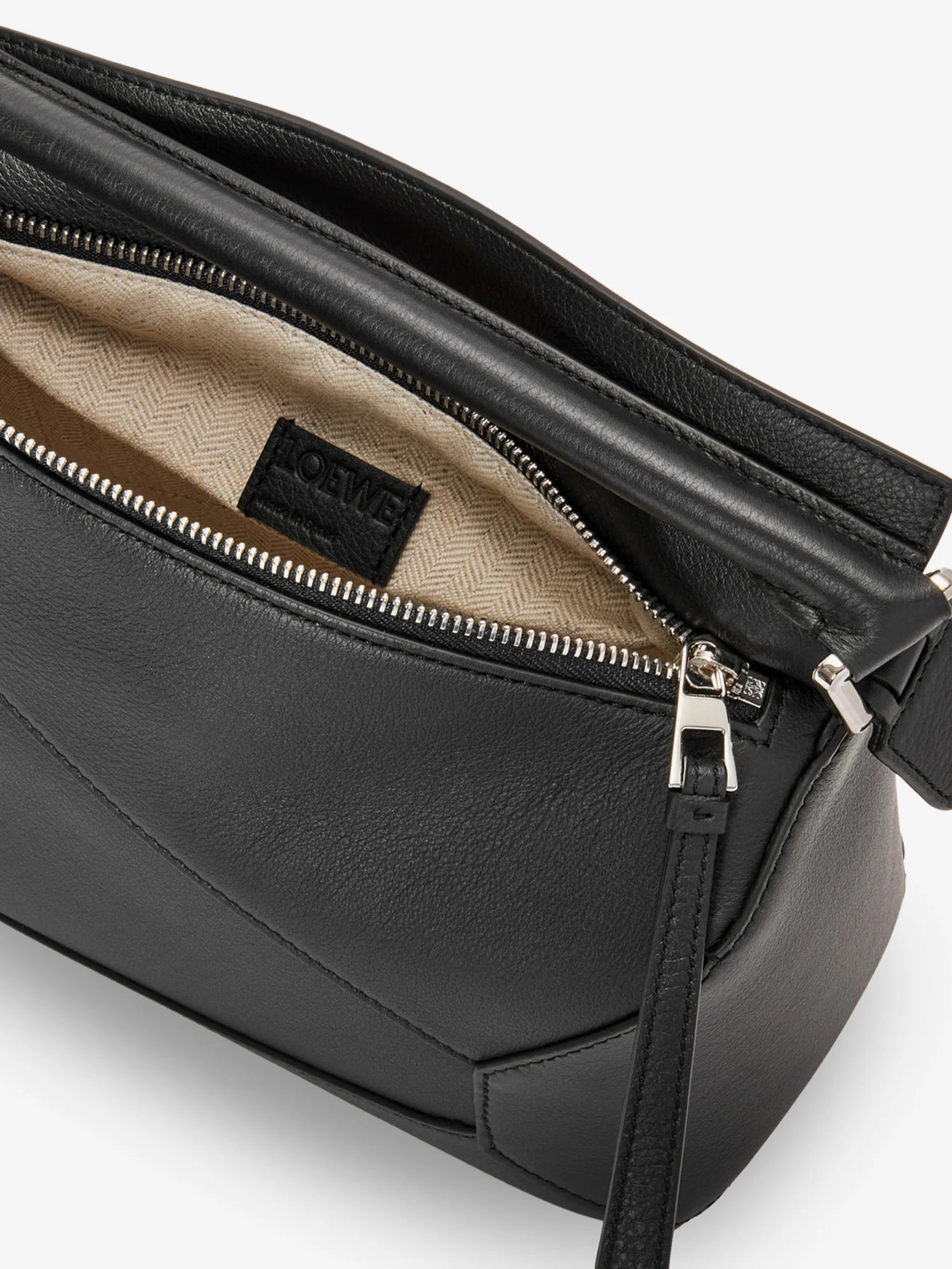 Puzzle Edge leather handbag with engraved Anagram logo