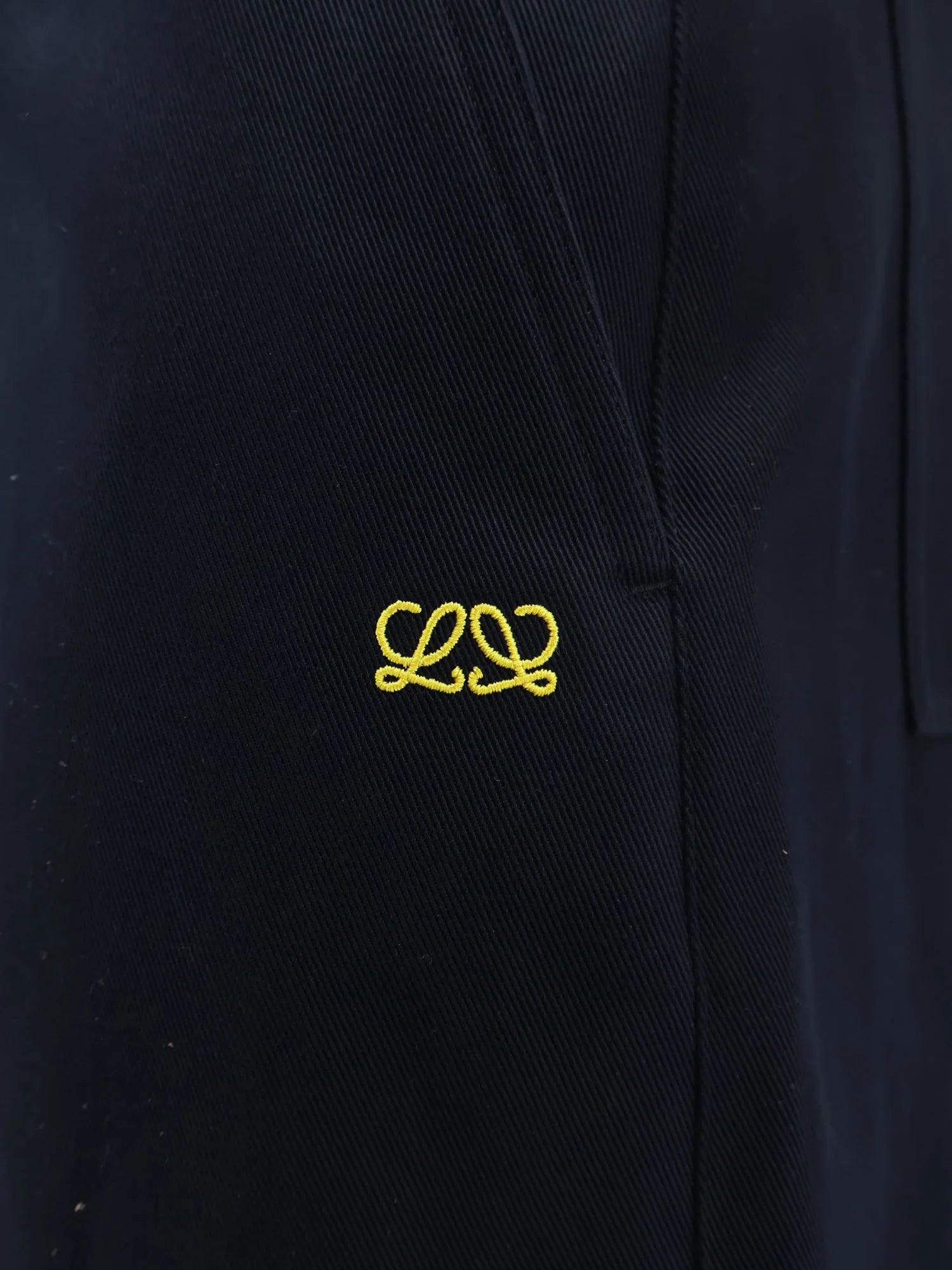 Denim trousers with contrasting embroidered logo