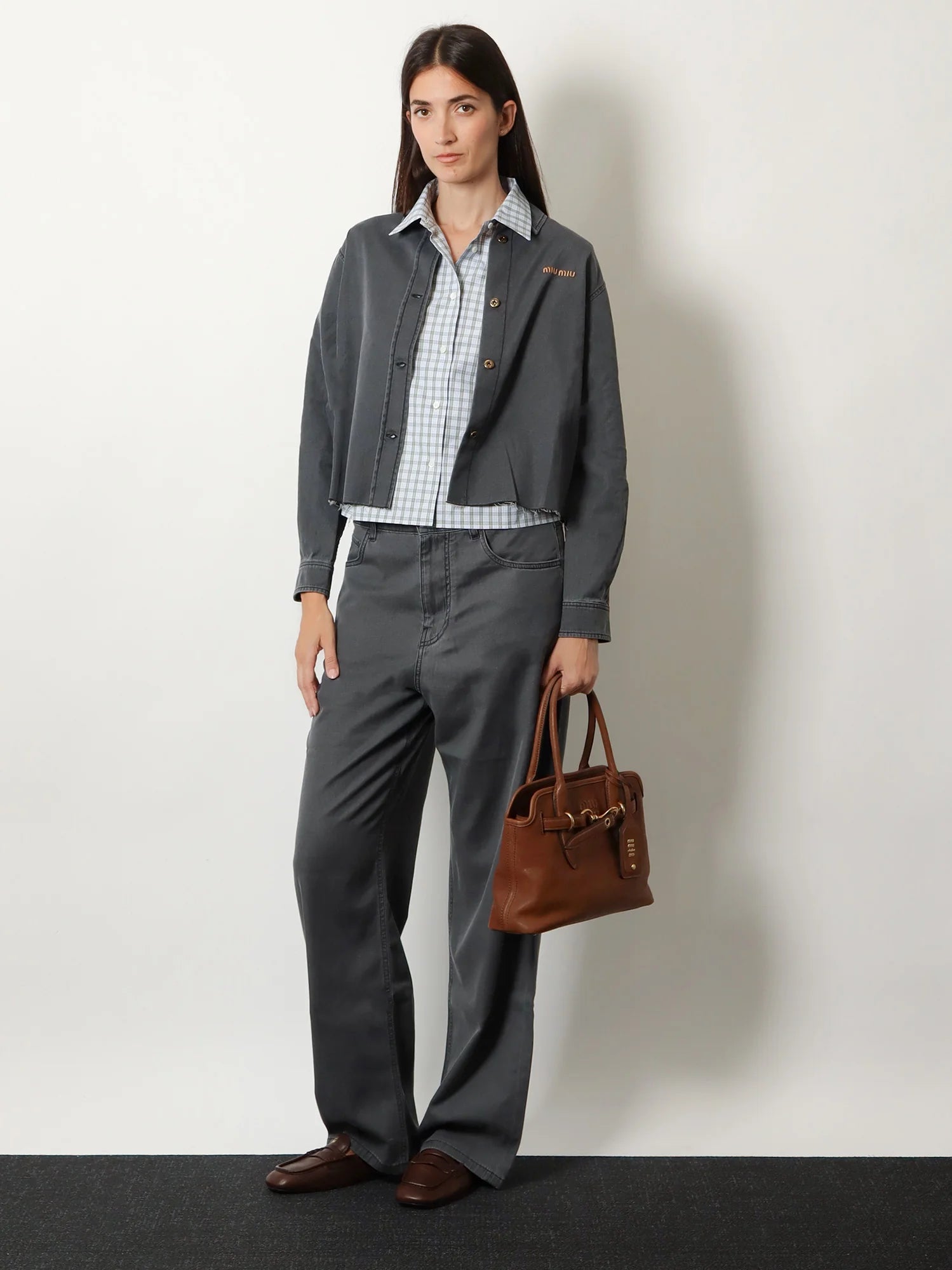 Aventure leather handbag with embossed lettering logo