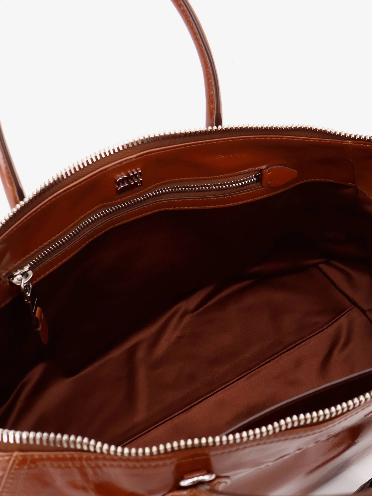 Shiny leather handbag with front lettering logo