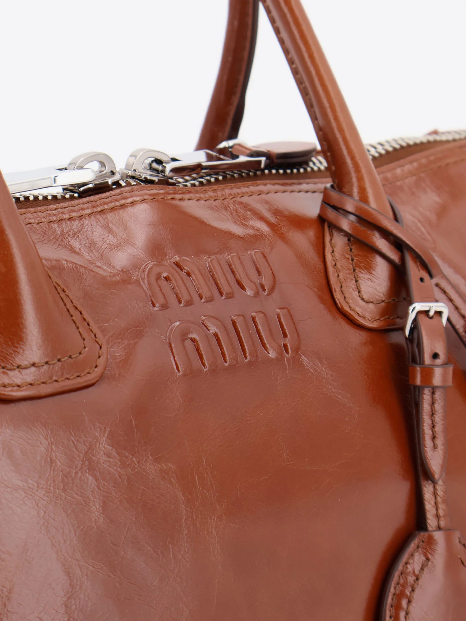 Shiny leather handbag with front lettering logo