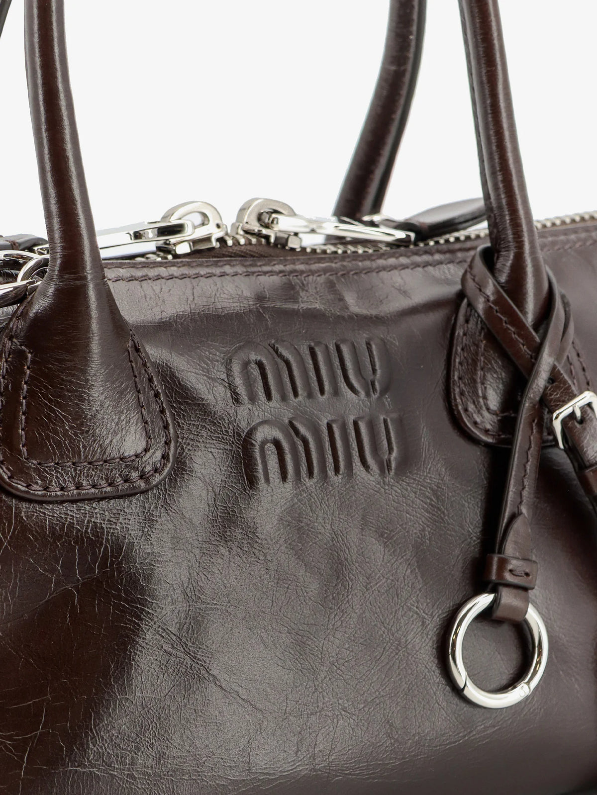 Leather handbag with embossed lettering logo