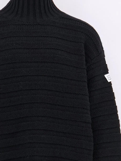 Wool blend sweater with distressed effect