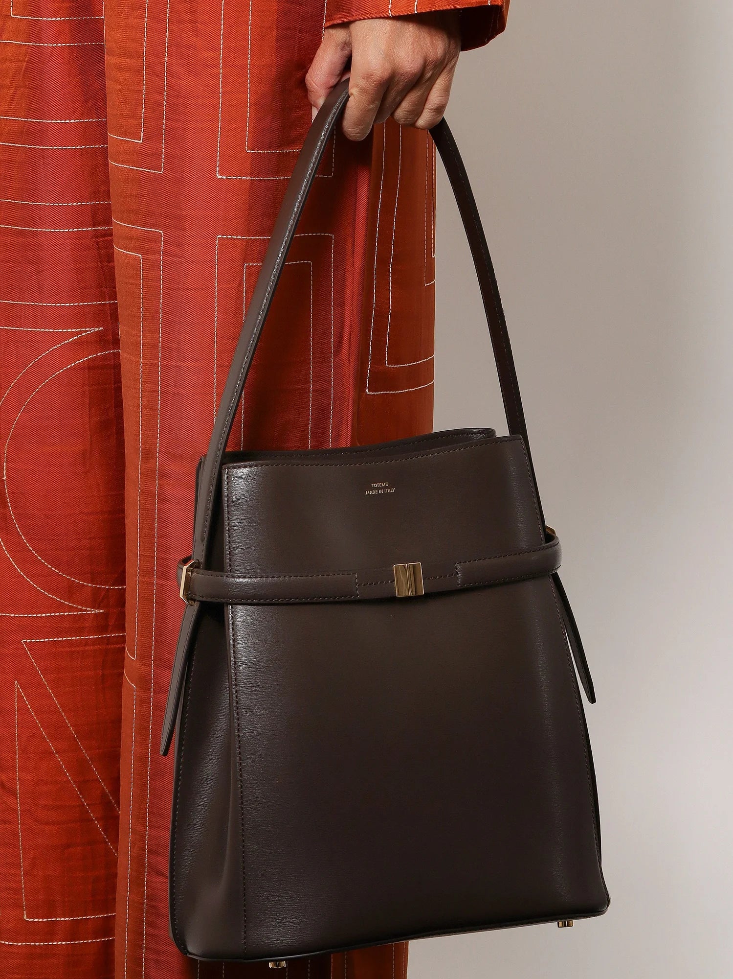Belted leather bucket bag